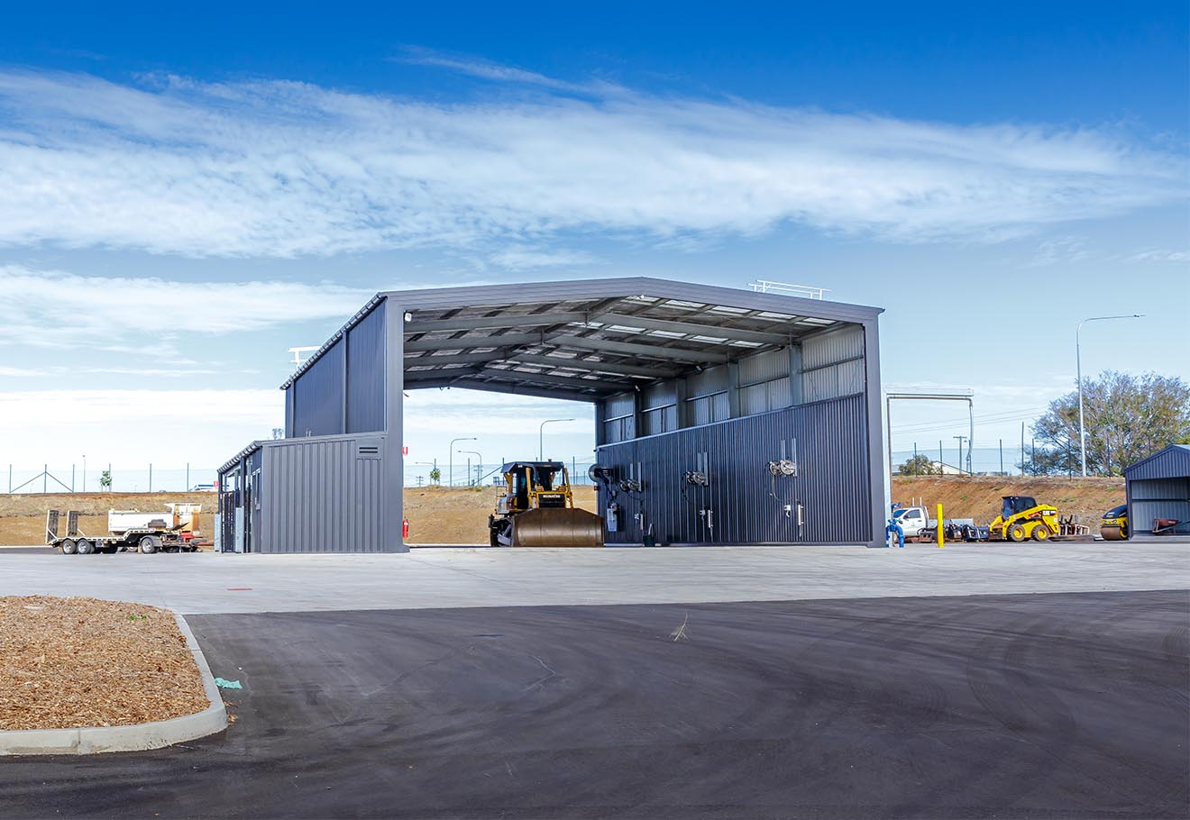 Bulldozer parked in industrial shed